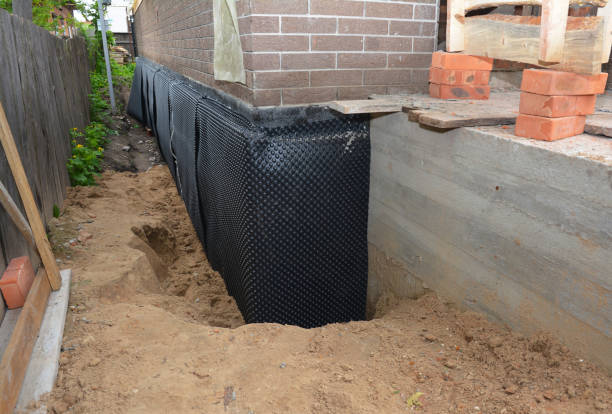 Happy homeowners after waterproofing job in Mitchells